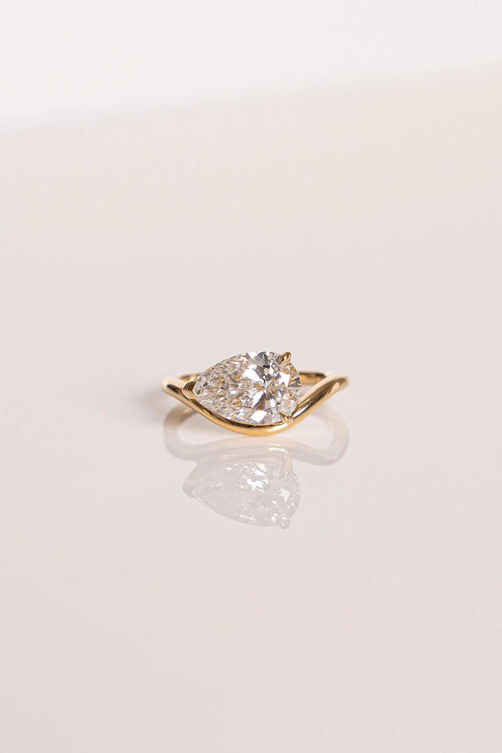 Pear Cut Moissanite Curved Solitaire Engagement Ring
