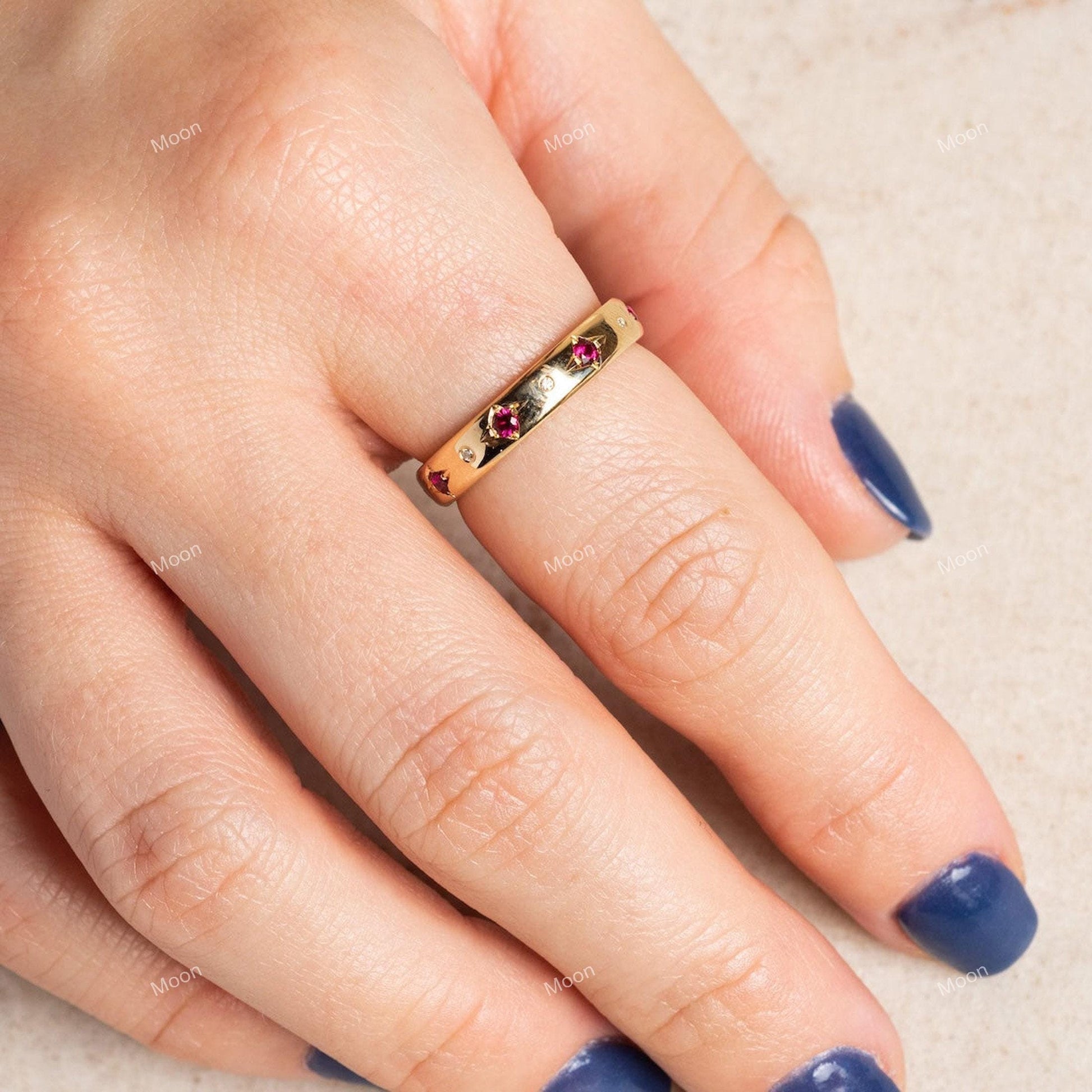 14k Gold Ruby Wedding Band with model hand