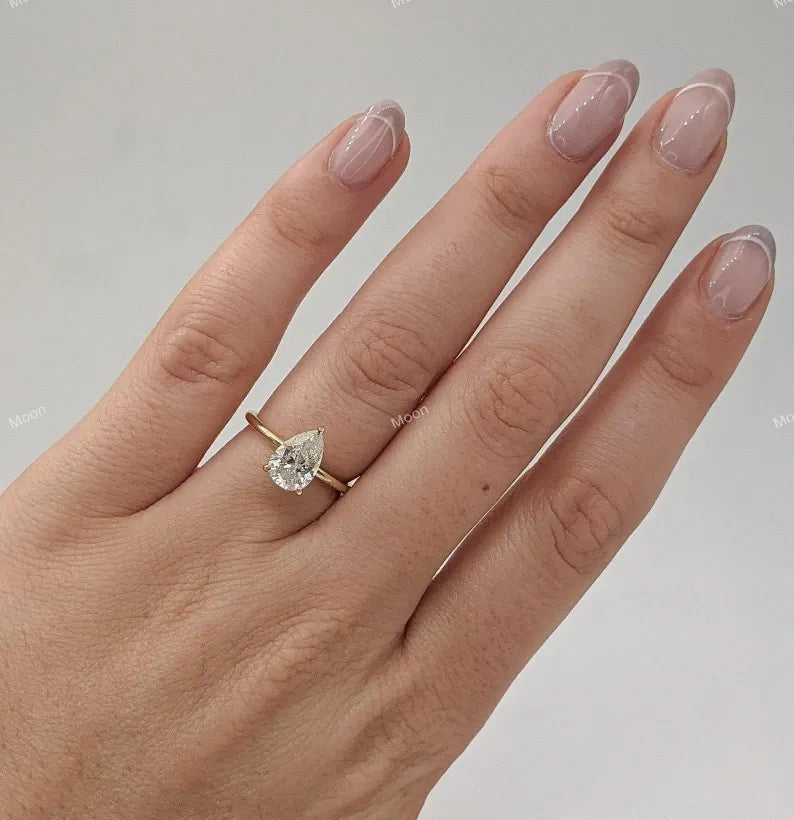 2 CT Pear Cut Moissanite Engagement Ring With Model Hand