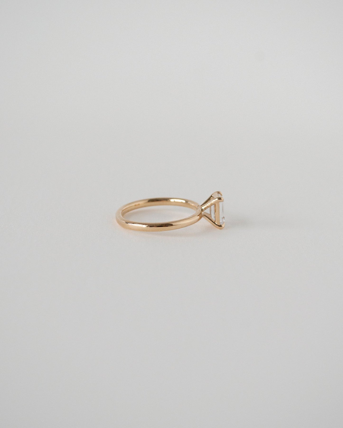 Emerald Cut Moissanite Solitaire Ring 14k Rose Gold Side View