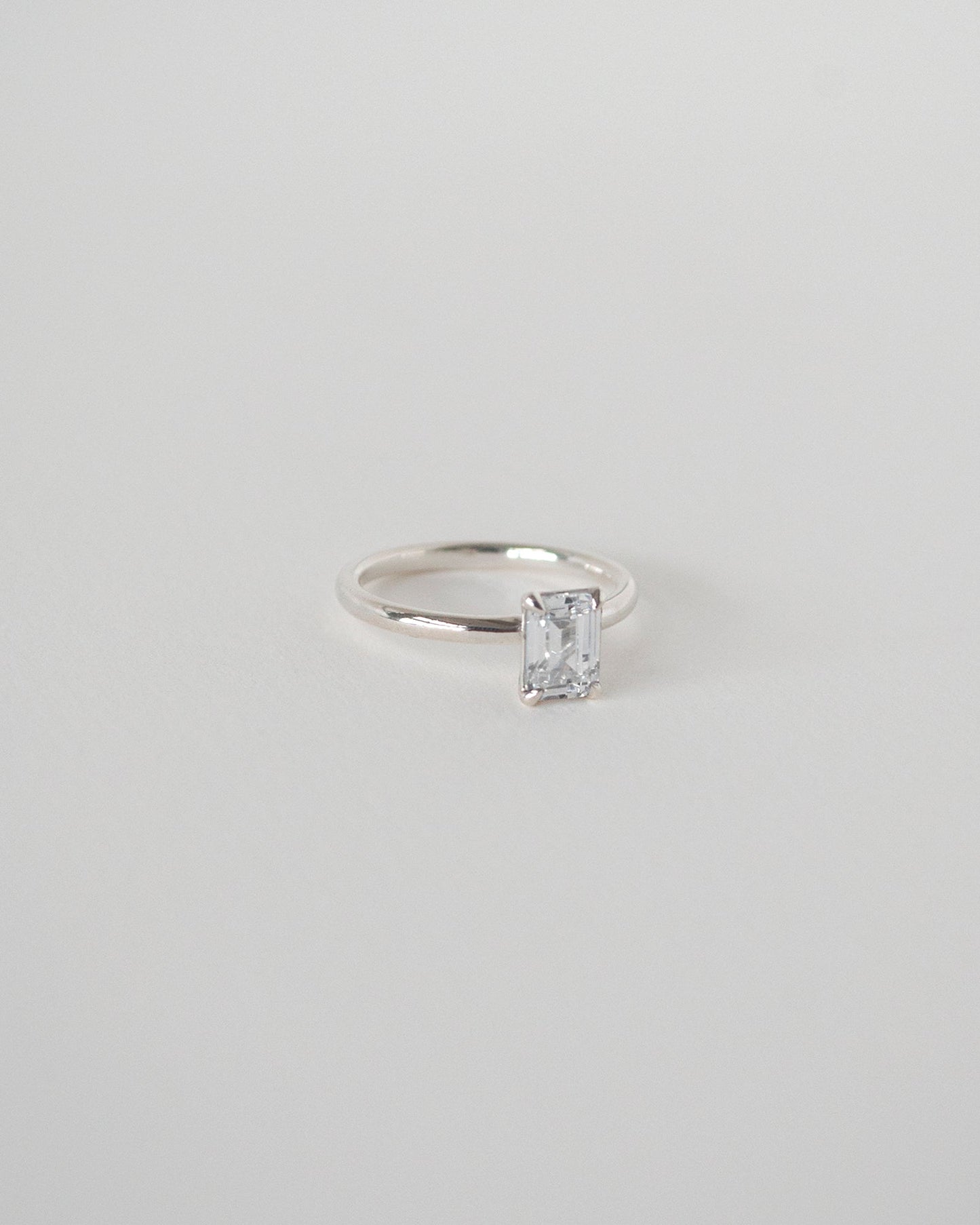 Emerald Cut Moissanite Solitaire Ring 14k Rose Sliver Side View